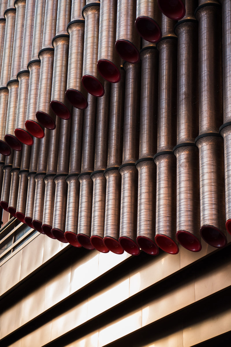PVD Double Stone Steel coloured stainless steel façade of the Fosun Cultural Arts Centre, Shanghai Bund, China.